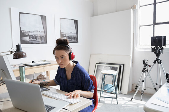 Artist using computer in a studio